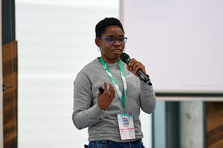 Amy Mbaegbu speaking at DevRelCon Prague